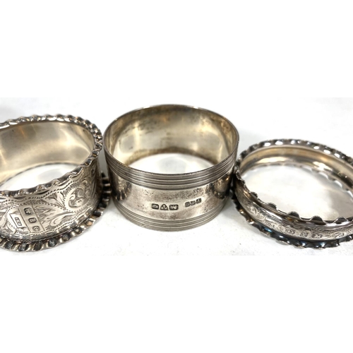 706 - A selection of hallmarked silver napkin rings, tea spoons and various white metal and EPNS items.