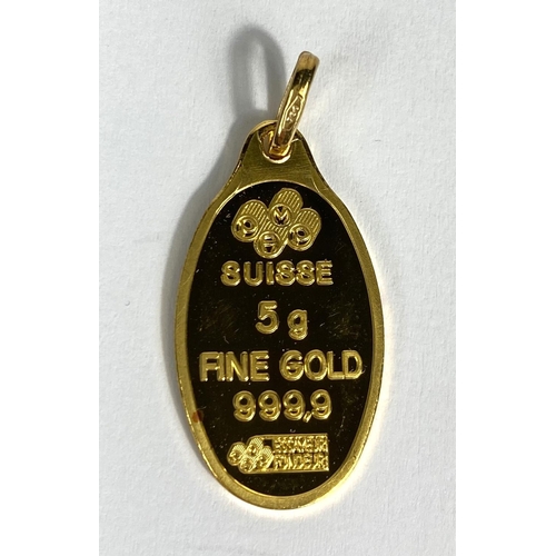 722 - A yellow metal oval pendant stamped 'Suisse 5g 999.9', the loop stamped 750