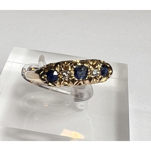 728A - An 18ct hallmarked gold 'gypsy' style dress ring set with 3 sapphires and 2 small diamonds, 3.2gm, s... 