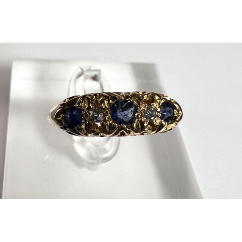 728A - An 18ct hallmarked gold 'gypsy' style dress ring set with 3 sapphires and 2 small diamonds, 3.2gm, s... 