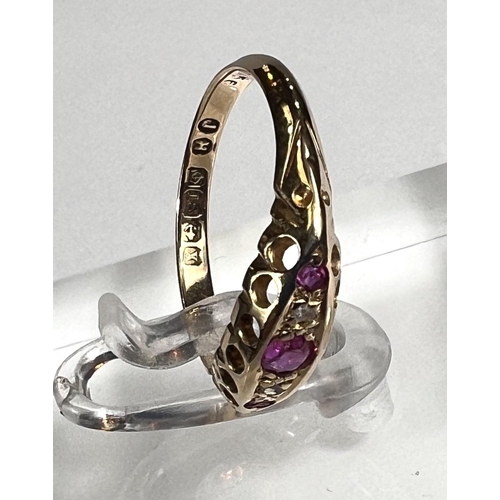 729 - An 18ct hallmarked gold 'gypsy' style lady's dress ring set with 3 rubies and 2 small diamonds, 1.8g... 