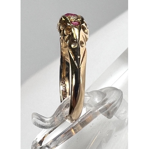 729 - An 18ct hallmarked gold 'gypsy' style lady's dress ring set with 3 rubies and 2 small diamonds, 1.8g... 