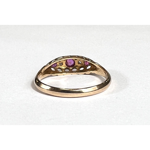 729 - An 18ct hallmarked gold 'gypsy' style lady's dress ring set with 3 rubies and 2 small diamonds, 1.8g... 