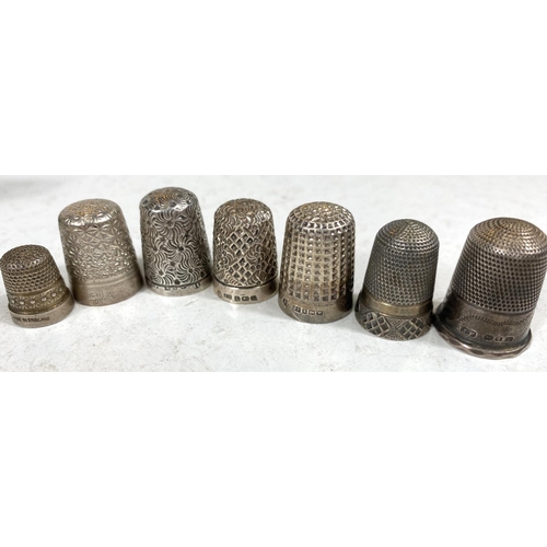 732 - 4 hallmarked silver thimbles and 3 others, a thimble box and other sewing requisites