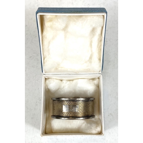 732A - A pair of hallmarked silver napkin rings, boxed, another, boxed, 46.6gm (15oz); a hallmarked silver ... 