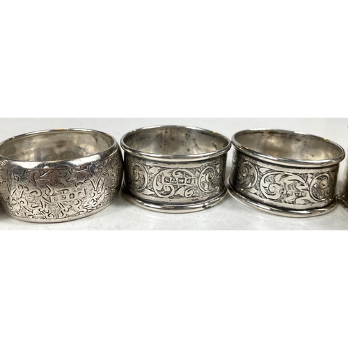 733B - 8 hallmarked silver napkin rings, various designs, dates and assay offices, 102gm