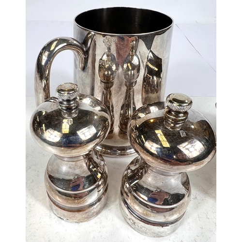 735 - A pair of hallmarked silver salt and pepper grinders, Birmingham circa 2000; an EPNS pint mug and ju... 