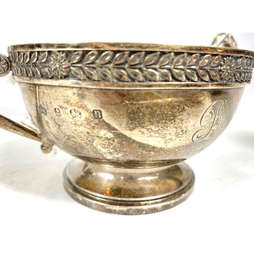 747 - A four piece hallmarked silver Georgian style tea service decorated with floral and leaf bands, pine... 