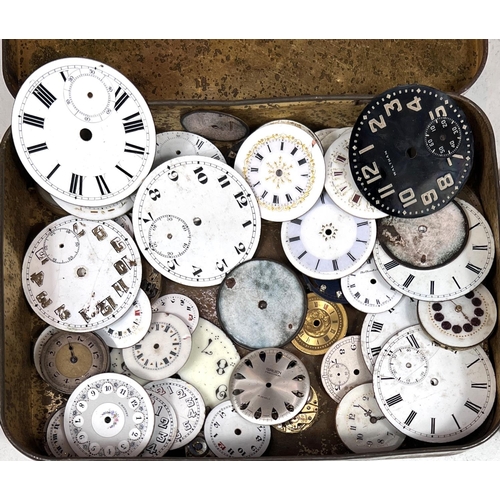 750B - A tin containing a quantity of differing size watch faces and some movements.