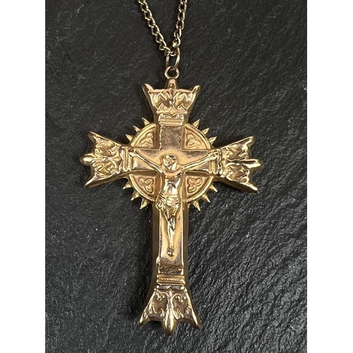 752 - A 9 carat gold cross pendant; a chain stamped 375; another 9 carat pendant, 6.6gms gross.