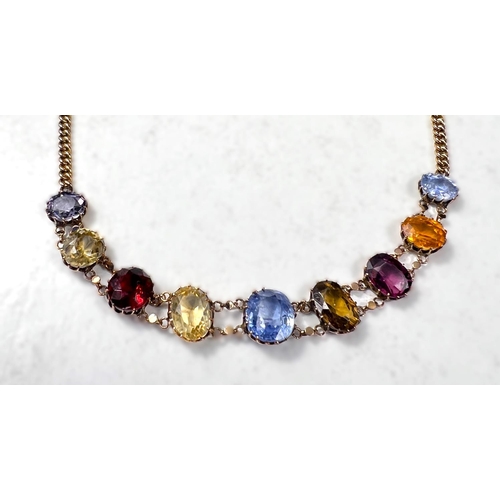 761 - A 9 carat gold chain bracelet set with graduating oval gem stones, including citrine, garnet, zircon... 