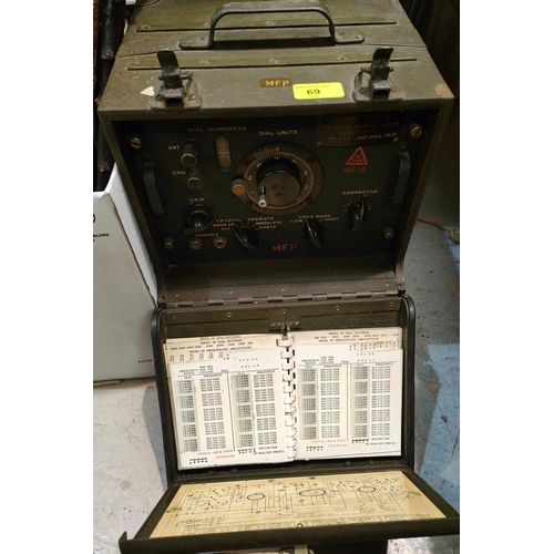 69 - A post WWII military Signal Corps Frequency meter with internal booklets