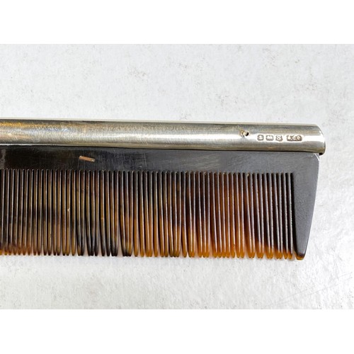 612 - A silver pair of cased hairbrushes and a comb