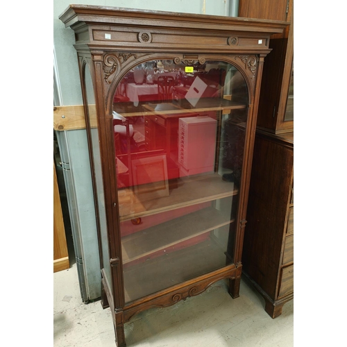 899 - A narrow Edwardian mahogany full height display cabinet enclosed by single door on square legs, 4 in... 