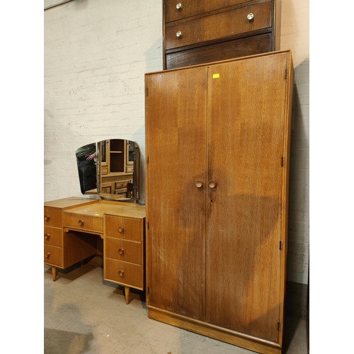 919 - A mid 20th century light oak dressing table and matching double wardrobe