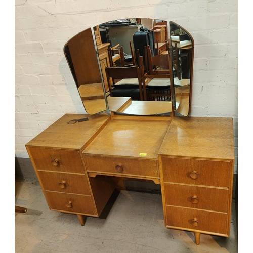 919 - A mid 20th century light oak dressing table and matching double wardrobe