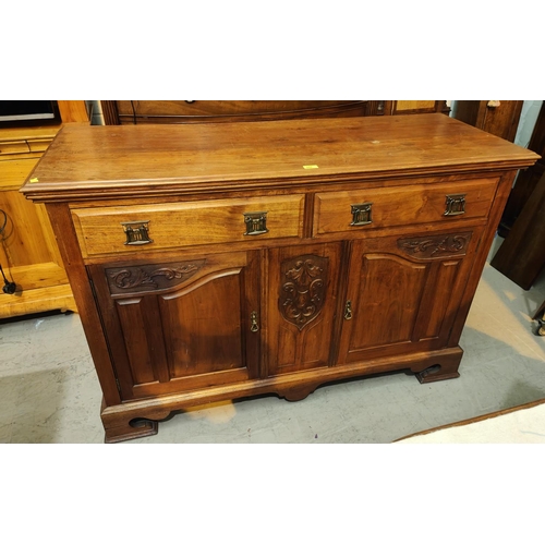 947 - An Edwardian carved walnut sideboard base of 2 drawers and 2 cupboards, on plinth