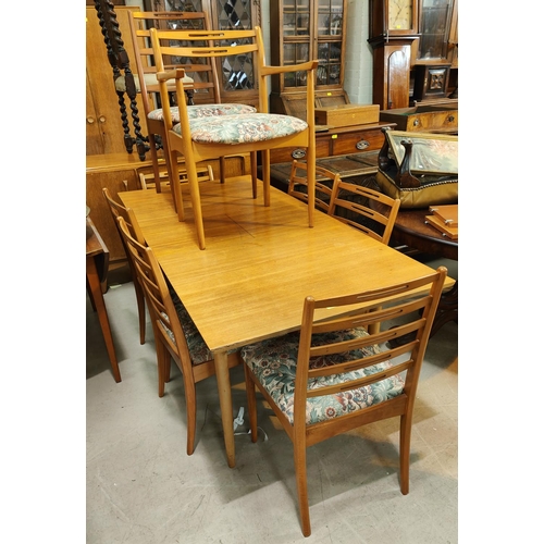 968 - A 1970's G Plan style teak dining suite, comprising of a rectangular extendable table and 6 pierced ... 