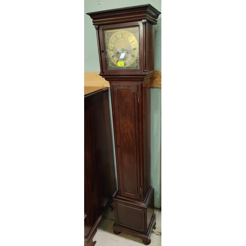 977 - A mahogany cased, brass dial, granddaughter clock with chiming movement.