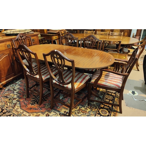 987 - A Regency style dining suite comprising extending twin pedestal dining table, 6 shield back chairs