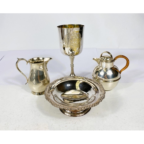 734 - A hallmarked silver milk jug, London 1947 and 3 pieces of silver plate.