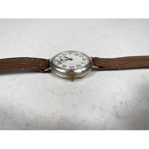 779F - A silver cased officers style trench watch on leather strap