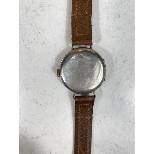 779F - A silver cased officers style trench watch on leather strap