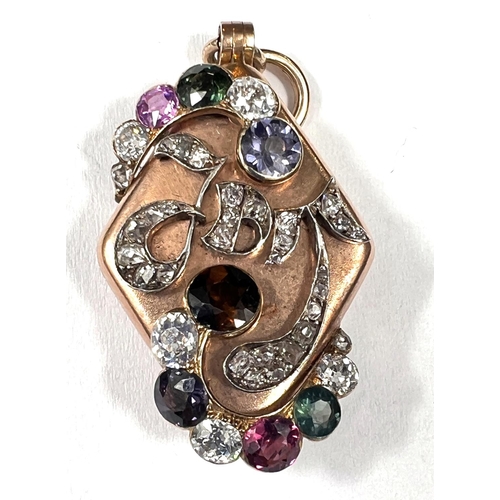 700 - An unusual 19th century Russian locket pendant, the diamond shaped, rose gold case is set with multi... 