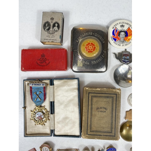 751B - A selection of small collectables including medallions, thimbles, tea caddy scoops, badges etc.