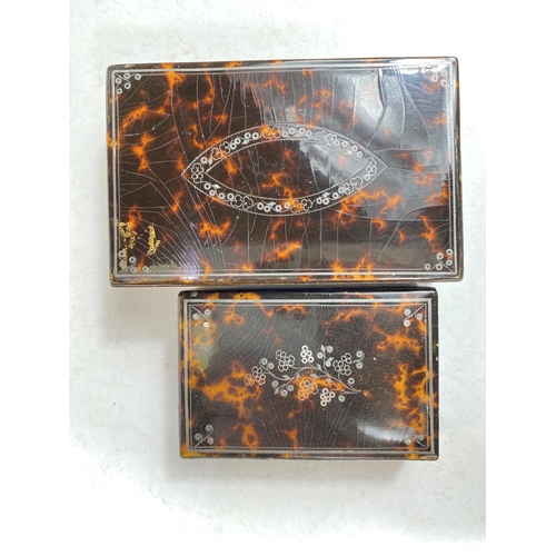 774 - A vintage tortoise shell playing card box 11 x 7cm, silver inlay and another.