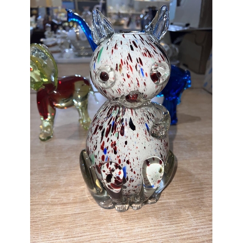 587 - A blue Murano glass elephant and a similar yellow and red glass Murano elephant, both with raised tr... 