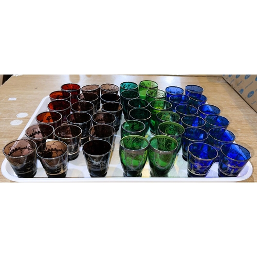 587E - A selection of approx. 45 blue, red and green 'shot' sized glasses with silvered decoration of Venic... 