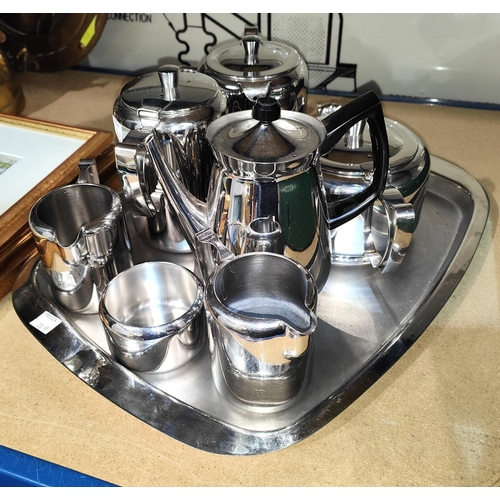 10B - A stainless steel Sheffield Old Hall 7 piece tea set with tray and another.