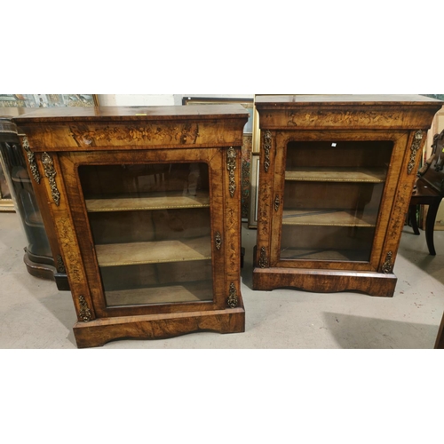 926 - A mid 19th century pair of walnut pier cabinets in the French manner with ornate ormolu mounts and f... 