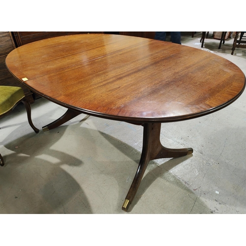 972 - A reproduction mahogany twin pedestal dining table.