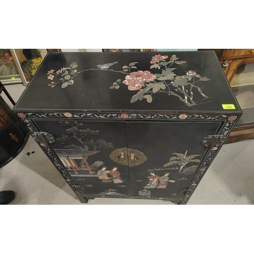 980 - A Chinese black cabinet with coloured floral and bird decoration 