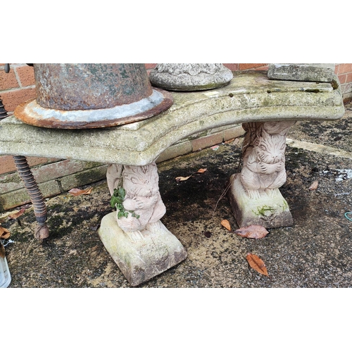 955 - A reconstituted stone bench with squirrel supports.