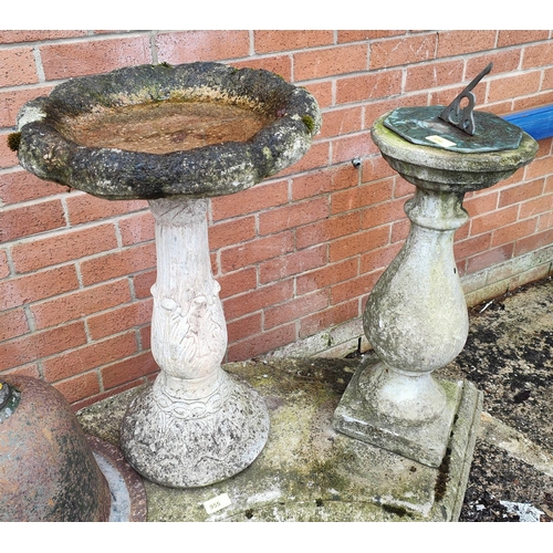 956 - A stone garden sundial and a similar bird bath.