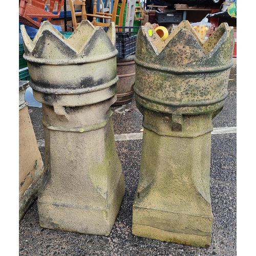 958 - A pair of circular crown top chimney pots.