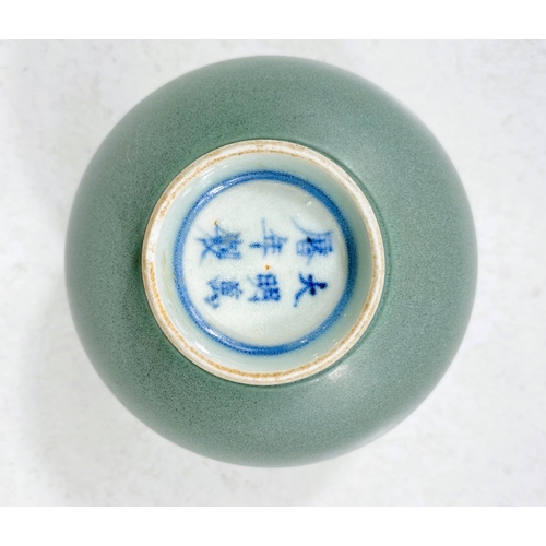 524M - A Chinese sage green ground bowl, six character mark to base, ht. 7cm