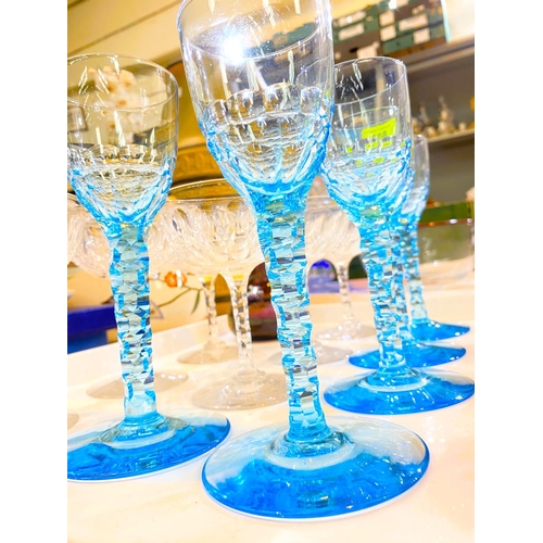 588 - A set of 5 late 19th century, early 20th century light blue slice cut stemmed glasses, 6 coupe glass... 