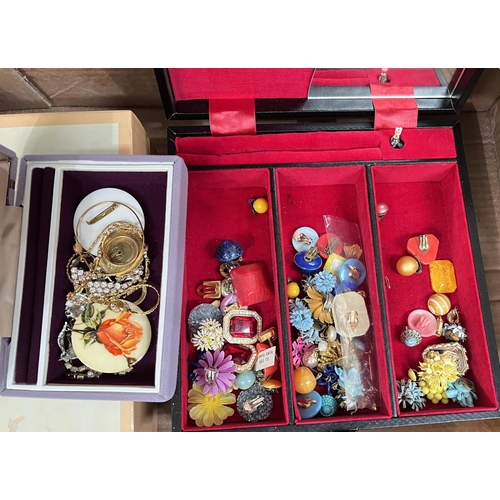 753A - A large quantity of costume jewellery and dress items, together with 4 jewellery boxes.