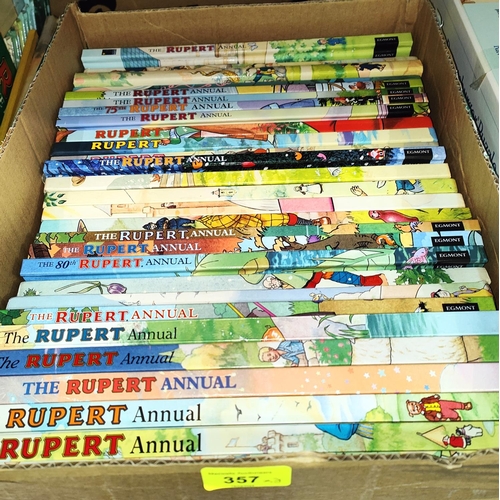 357 - A collection of vintage Rupert Bear jigsaws, vintage annuals, videos and cassette tapes