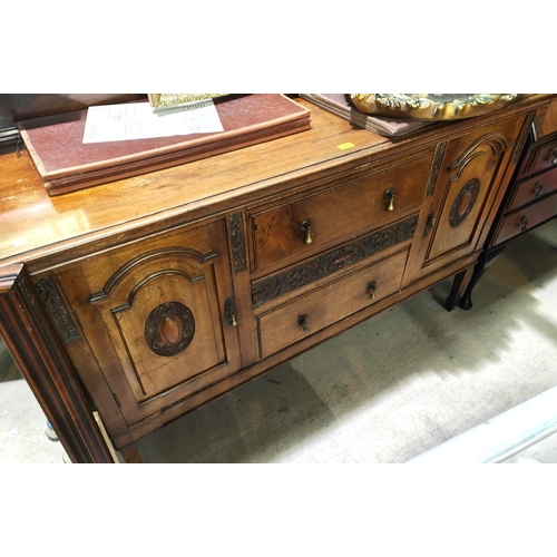 874 - An early 20th century mahogany sideboard with 2 arch panel end cupboards and 2 central drawers on sq... 