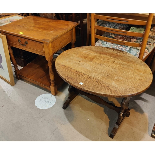 964 - An oak two tier occasional table with drawer; an oval oak occasional table; a stained wood folding c... 