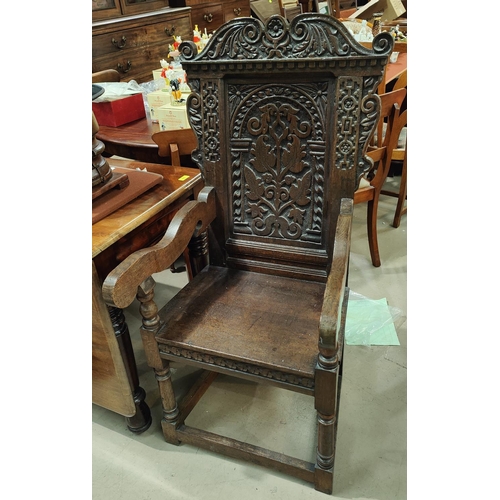 967 - A 17th century style carved oak wainscot chair.