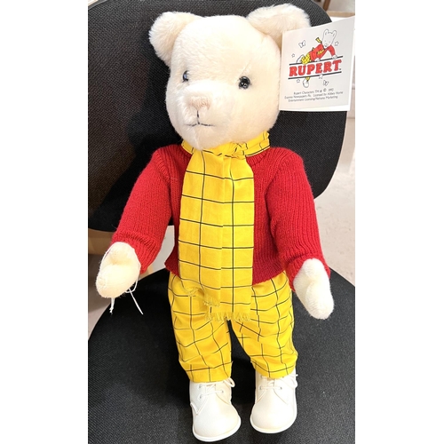 306 - A Merrythought Rupert Bear with original tag and box, red jumper, yellow & black trousers & ... 