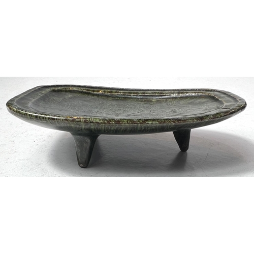 495D - An unusual Chinese ceramic stand shaped oval on three feet, green and black swirling decoration, len... 