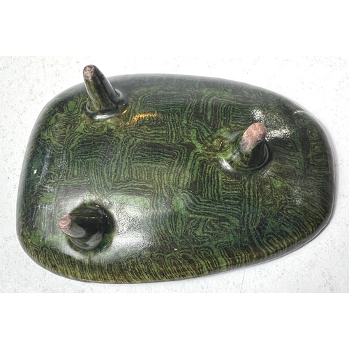 495D - An unusual Chinese ceramic stand shaped oval on three feet, green and black swirling decoration, len... 