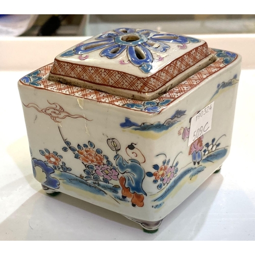 509C - A Chinese lidded pot with polychrome domestic scenes, diamond shape with pierced lid, length 10.5cm